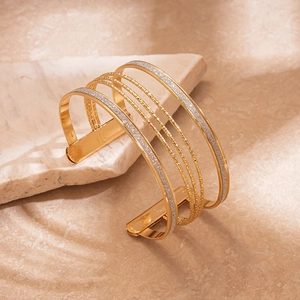 Minimalist multi-layer geometric open cuff bracelet in polished gold and silver glitter finish