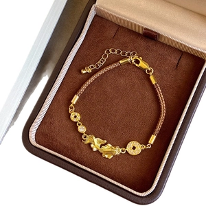 Zircon koi fish bracelet with gold plating and brown woven cord in a luxury gift box