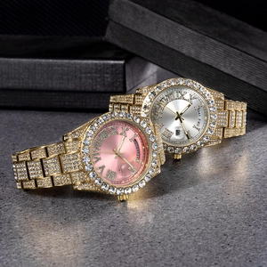 Macro shot of luxury iced-out watches featuring diamond encrusting and day-date display
