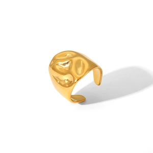 Detail of the golden irregular lava texture on an adjustable stainless steel ring