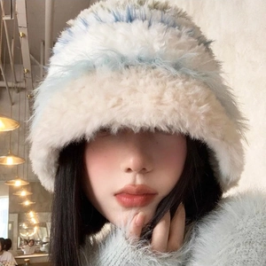 Close-up of thick plush bucket hat showing tricolor blue white beige faux fur texture