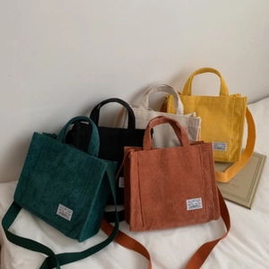 Corduroy crossbody tote bag in five colors with adjustable strap and front label detail