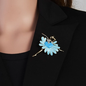 Close-up of ballet dancer brooch with blue enamel on a black suit lapel