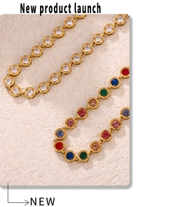 Macro detail of gold-plated tennis necklace featuring vibrant multi-colored zirconia stones