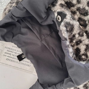 Detail of leopard print faux fur tote with high-quality metal snap button and lining