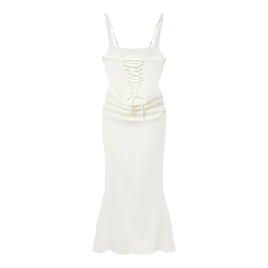 Detail of the white maxi dress showing thin straps and cross-lace back design details