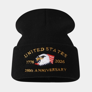 Close-up of bald eagle embroidery on a black knit beanie for the 250th anniversary