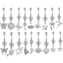 Macro shot of 18-piece silver belly button ring set with heart and butterfly charms