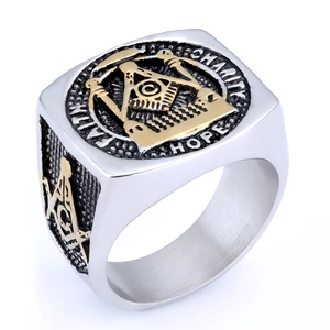 Detail showing Freemason signet ring with Faith Hope Charity engraving in silver and gold