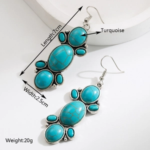 Detail view of retro silver earrings with turquoise stones and dimensions 7cm by 2.5cm
