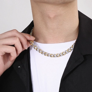 Hip hop two-tone silver and gold plated Figaro chain necklace on a male model