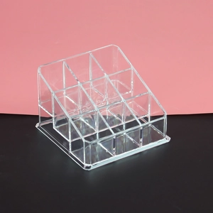 Close-up of 9-slot transparent acrylic organizer for lipstick and lip glaze storage