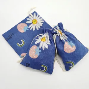 Blue linen cotton drawstring pouch featuring white daisies and strawberry prints