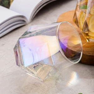 Detailed view of an iridescent hexagonal glass cup reflecting a colorful rainbow finish
