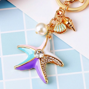 Starfish and seashell gold keychain with colorful enamel, pearls, and rhinestones