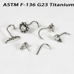 G23 titanium nose studs with sparkling zirconia crystals in various minimalist shapes