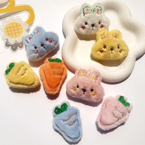 Detailed view of plush rabbit and carrot accessories for DIY crafts and hairpins