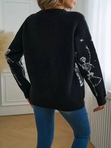 Detailed back view of a black knit sweater featuring white skeletal bone jacquard patterns