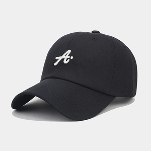 Detail of high-quality 3D white letter A embroidery on a black cotton baseball cap