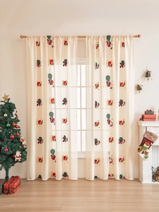 Detailed view of cream lace Christmas curtains with Santa embroidery and wavy edges