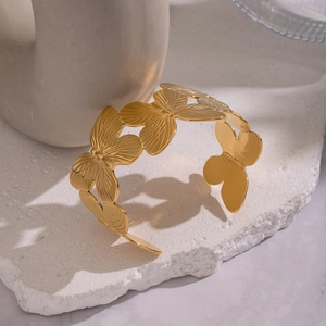 Exaggerated wide butterfly open cuff bracelet in 18K gold plated stainless steel