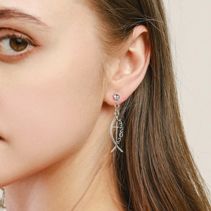 Silver stainless steel fish cross earrings with Jesus engraving on female model