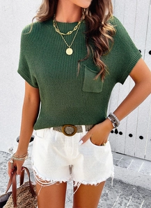 Detail showing the chest pocket and texture of the green short sleeve knit top