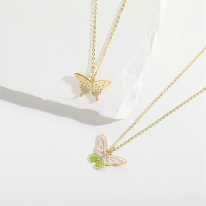 Exquisite gold butterfly necklace with crystal pavé and pink-green enamel pendants