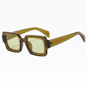 Macro side view of retro amber tortoiseshell square sunglasses with pale yellow lenses