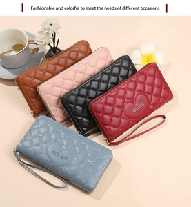 Luxe quilted heart pattern wallets in multiple colors with elegant zip closure and logo