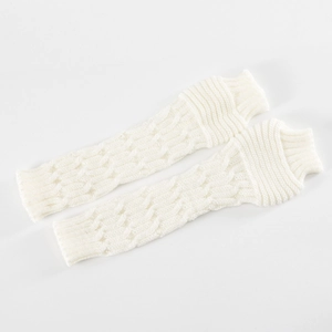 Close-up of cream white cable knit arm warmers with ribbed elastic cuffs on plain background
