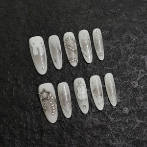 Handmade Y2K press-on nails featuring hand-painted silver rabbits and sparkling rhinestones