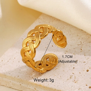 Detail view of gold geometric cross ring showing 1.7cm adjustable diameter and 3g weight