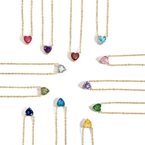 Macro display of 11 colorful heart-shaped crystal pendants on 14k gold plated necklaces