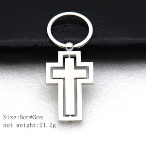 Rotating silver cross metal keychain accessory for car and bag, 8cm x 3cm size