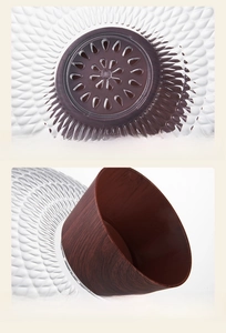 Detail of fruit tray featuring water drainage holes and stable wood-grain textured base