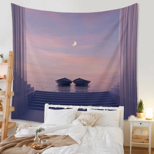 Bedroom scene showing a bohemian landscape tapestry with a purple lake and moon hanging over a bed
