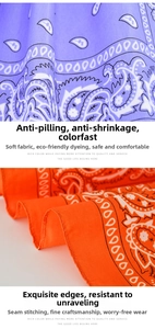 Close-up of paisley bandana with purple and orange patterns and reinforced stitching