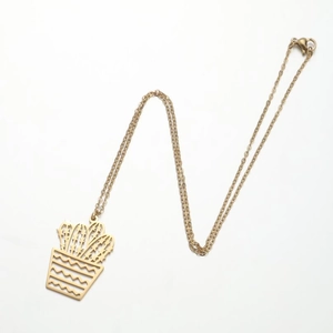 Detailed view of a gold hollow cactus pendant necklace on a clean white background