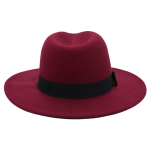 Detailed close-up of wine red wool fedora hat with wide brim and black ribbon band