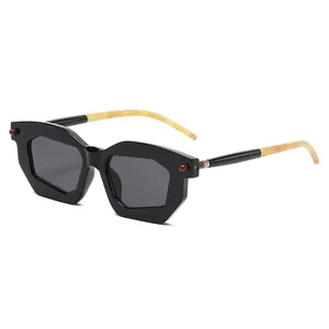 Modern hexagonal geometric sunglasses with yellow marble temples and black frames
