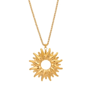 Detailed view of a gold sun pendant necklace with smooth metallic texture on white background