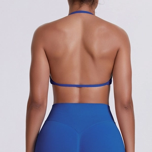 Rear view of cobalt blue halter sports bra and high-waist leggings set for workout