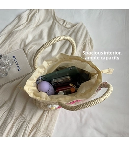 Spacious interior of hand-woven straw bag showing storage capacity for daily essentials