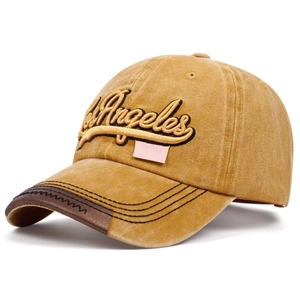 Washed cotton Los Angeles embroidered baseball cap in mustard yellow with brown leather brim