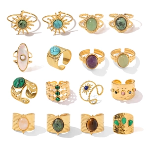 Detailed collection of vintage gold plated rings with natural stones and seashell inlays
