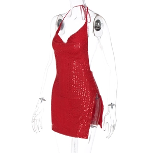 Detail of red sequin halter dress featuring a deep V-neck and sparkling fabric texture