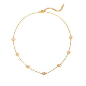 Detail view of a gold-plated stainless steel necklace featuring seven sparkling zircon stones