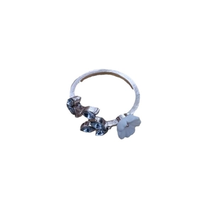 Adjustable silver branch ring with three blue leaf gems and a white 3D floral accent