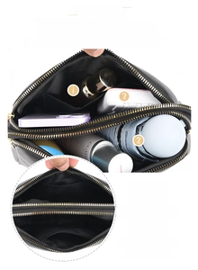 Detail view of black litchi grain crossbody bag with double zipper multi-layer storage compartments